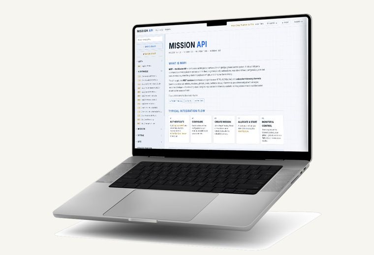 Mission API reference with the integration flow, shown on a laptop