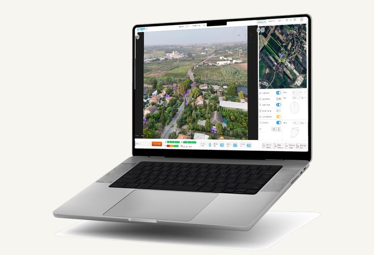 FlightOps wide aerial view with automatic vehicle detection, shown on a laptop